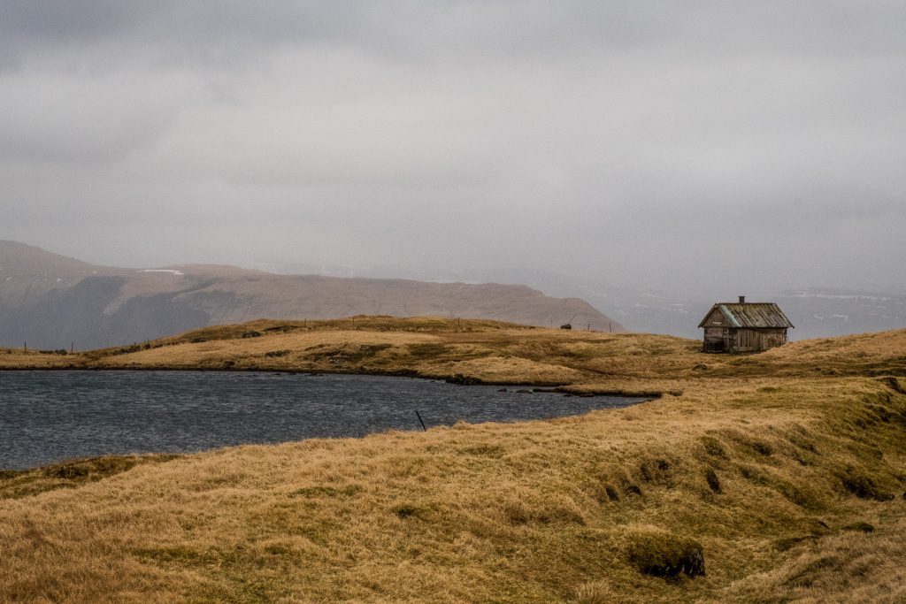 A lonely cottage on a lake in Sandoy